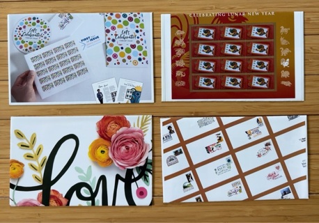 Four handmade Stamp themed envelopes 