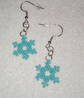 Handmade light blue beaded snowflake earrings