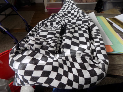 Black and white checkered sling backpack purse