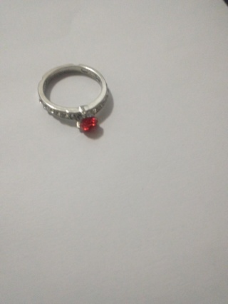 ring with red jem over stainless steel 