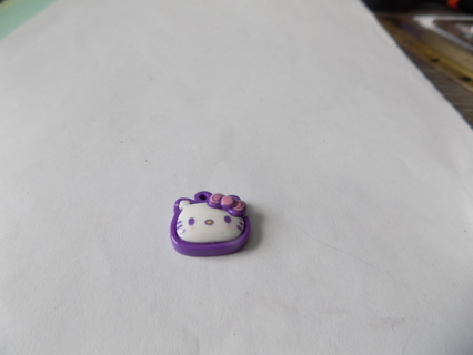 Hello Kitty necklace charm purple background 3D Hello Kitty face, pink bow