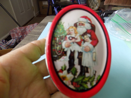 2 1/2 inch oval Santa tin green red, lid with new never lit candle inside