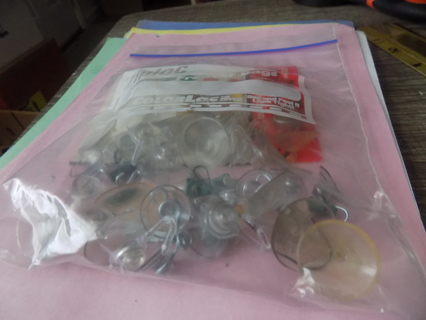 Bag full of clear plastic suction cups and hooks asst. sizes