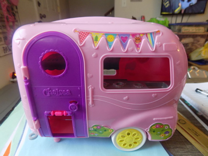 Chelsie's Barbie pink camper with purple door