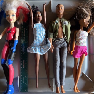 4 Barbie type dolls