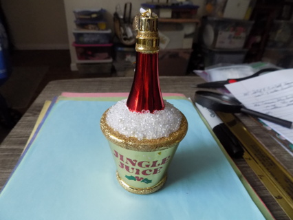 6 inch tall chilled red bottle of champagne ornament in ice bucket says Jingle Juice