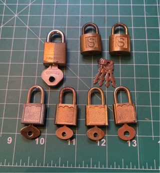 Collection of 7 Miniature Padlocks all with Keys