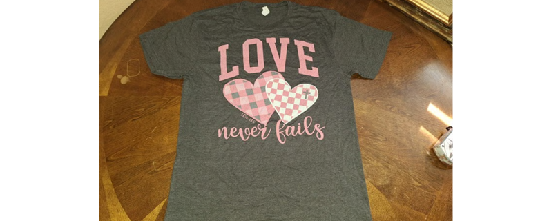 NEW LOVE NEVER FAILS, SOFT COTTON TEE SHIRT LADIES SIZE MEDIUM SUPER CUTE TOP