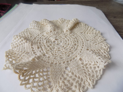 7 inch round tan crocheted doily