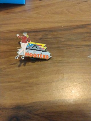 Hooters lapel pin