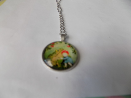 Childs' Fairy tale necklace.  Little girl hugging a frog & flower up side, domed on chain