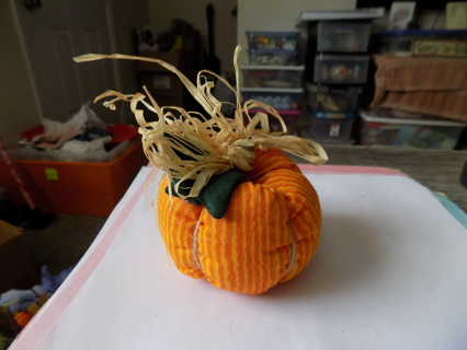 3 inch round # 7 orange and white stripe pumpkin, fabric leaf, wood stem, raffia