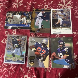 Three baseball and three football trading cards