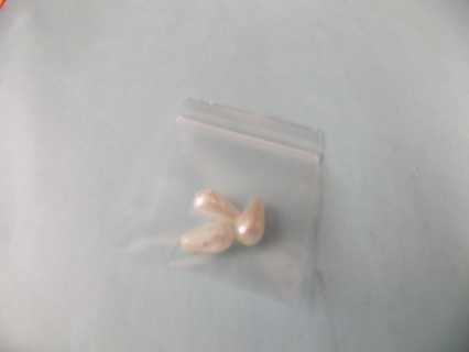 3 white tear drop shape beads