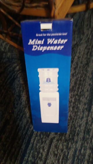 REDUCED**BRAND NEW. MINI WATER DISPENSER. HOLDS 8 GLASSES OF WATER. STILL WRAPPED IN FACTORY PLASTIC