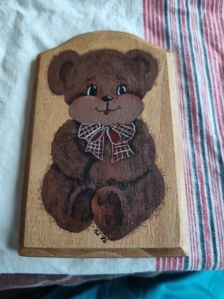 Bear on wooden plack