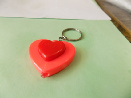 Orange and red heart shape light up keychain on metal rings