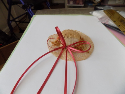 4 inch round straw hat decoration with dried flowers and rust color ribbon