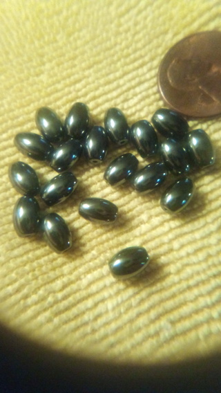Barrel shaped metallic beads 