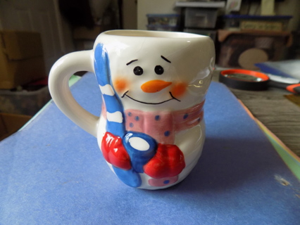 4 inch ceramic snowman pink pokadot scarf holds skies coffee mug