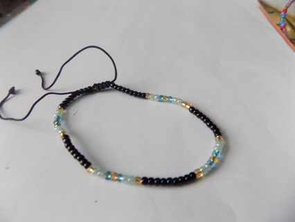 Bracelet E beads black, light blue, gold