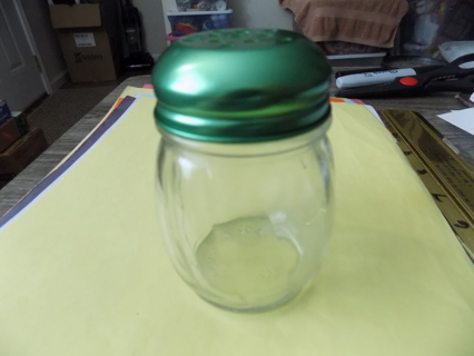 4 inch tall glass parmesean grated cheese shaker with green metal lid