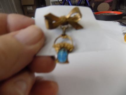 Vintage religious pin goldtone metal bow with basket flower, & Virgin Mary blue oval dangle