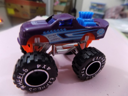 2 1/2 inch purple Monster Truck blue engine sticking up out of rear