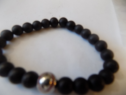 Black lava bead bracelet with silvertone baseball charm
