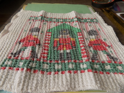 Christmas white woven dish rag has toy soldiers and guard house