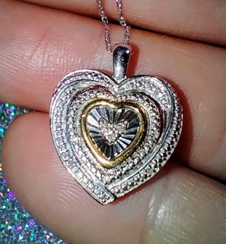 NECKLACE STERLING SILVER AND 10K YELLOW GOLD WITH AT LEAST FOUD DIAMONDS STERLING SILVER CHAIN ALSO.
