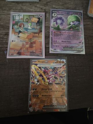 Set of three Pokémon Holo cards.