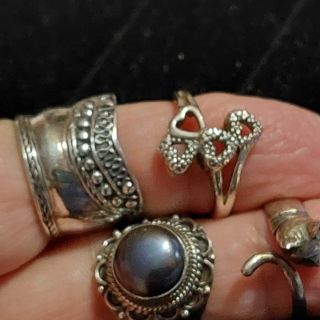 4 sterling silver rings size 8 approx