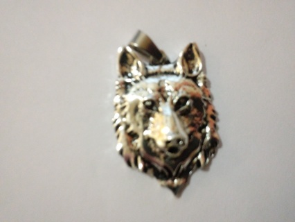 Silver wolf head over stainless steel 