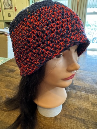 Qty of 1 Crocheted Hats. Colors are Navy Blue, Red, and light mixed Blue etc.. 