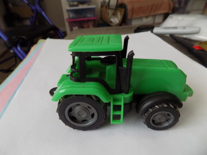 Green plastic tractor 4 inch long toy