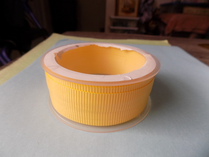 Spool of yellow curling ribbon