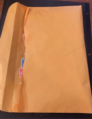 Big envelope filled with international stamps 