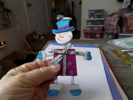 6 inch tall snowman ornament body pink sparkly head, arms, legs on springs blue hat, mittens,boots