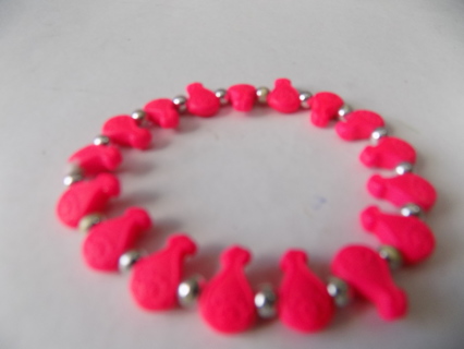 Hot pink money bags beads and silver beads bracelet on stretchy cord