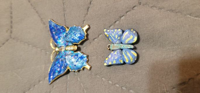 Two butterfly items, pendant and pin
