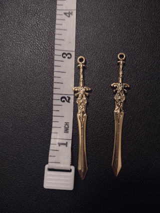 2 Gold-Colored Sword Charms