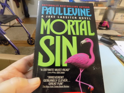 Mortal sin paperback  book by Paul Levine