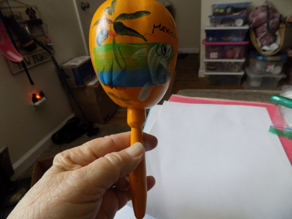 hand made and hand painted yellow maraca souvenir Mexico