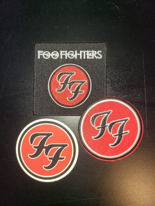 TWO NEW RED, BLACK & WHITE FOO FIGHTER IRON-ON PATCHES PLUS A BAND LOGO STICKER