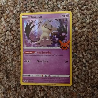 Mimikyu holographic Pokemon card.