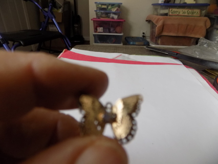 Goldtone double wing layered large butterfly charm with irredescent stone on it