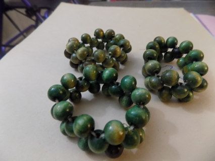 Set of 3 green wood bead napkin rings