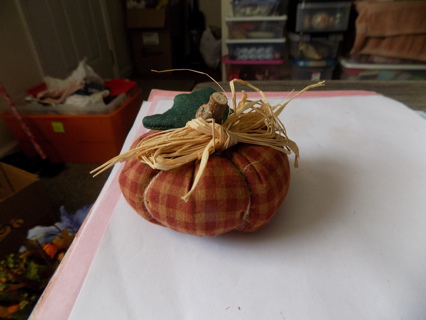 3 inch round # 10 rust and tan checkered pumpkin, fabric leaf, wood stem, raffia