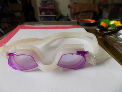 Purple and white swim goggles